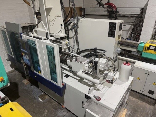 Used KRAUSS MAFFEI CX 2C 80-180-55 CX V injection moulding machine